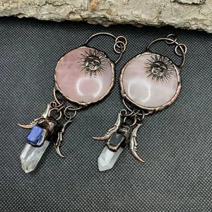 Vintage bronze sun god necklace featuring pink quartz and bohemian crystal elements