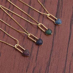 Golden box chain necklace featuring a heart charm pin pendant in four vibrant colors