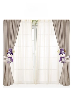 Detail showing purple sequin snowman curtain tiebacks on brown drapes for Christmas