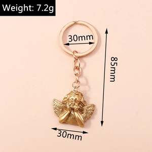 Detail of golden angel keychain showing dimensions 85mm length and 7.2g weight