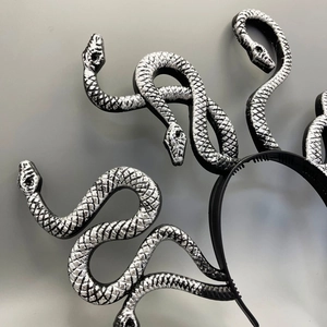 Close-up of black and silver Medusa snake headband with detailed metallic scale texture