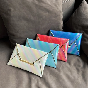 Set of four holographic envelope clutch bags with gold metal trim in assorted colors