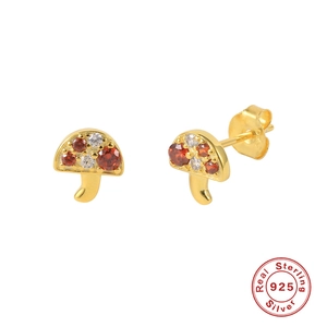 Macro view of gold plated S925 sterling silver mushroom studs with red zirconias