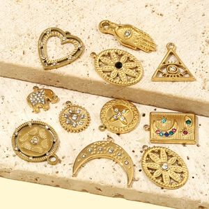 Golden stainless steel DIY charms with heart, moon, and palm designs for jewelry making