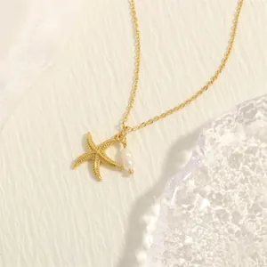 Detail of 18K gold plated starfish pendant necklace with a lustrous white pearl