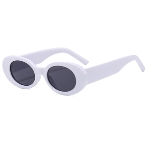 Retro white oval sunglasses with dark grey lenses in a 45-degree angle studio shot