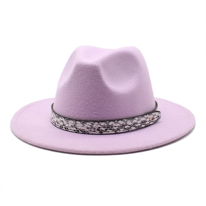 Detail of lavender wool fedora hat featuring snakeskin band and gold stud accents