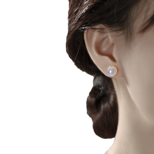 Elegant round iridescent pearl stud earrings for women with a minimalist aesthetic style