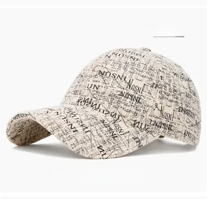 Detail of cream corduroy baseball cap with all-over black INSUN letter embroidery