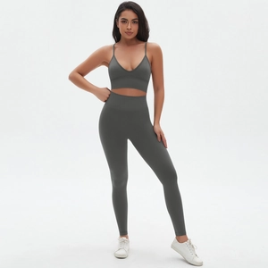 Detail view of seamless dark grey yoga set featuring v-neck bra and high waist leggings