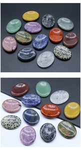 Detailed view of assorted natural crystal oval thumb stones in various vibrant gemstone colors