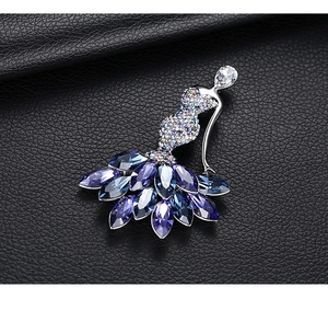 Close-up of ballet dancer brooch with sparkling blue and purple marquise crystals