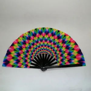 Detail of the vibrant rainbow gradient fabric and black ribs of the handheld folding fan