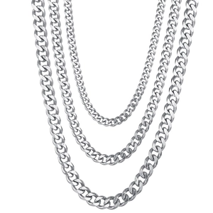 Three-layered polished silver Cuban chain necklace with varying lengths and metal shine