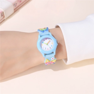Macro shot of colorful 3D butterflies and floral relief on a light blue silicone watch band