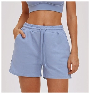 Detail of light blue athletic shorts with elastic drawstring waist and side pockets
