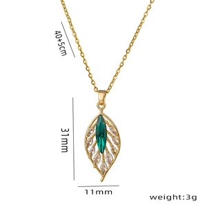 Elegant gold necklace featuring a leaf pendant with green and clear marquise zircons