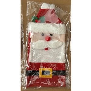 Detail of knitted Christmas wine bottle cover with Santa Claus face in OPP packaging