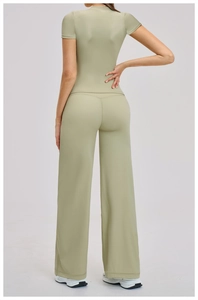 Back view of sage green yoga set with slim fit short sleeve top and wide leg pants