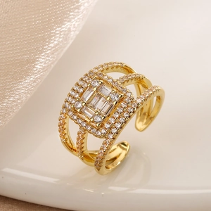 Elegant gold-plated open ring featuring layered design and sparkling cubic zirconia stones