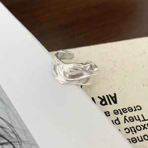 Minimalist 925 silver ring featuring irregular lava texture and an adjustable open band