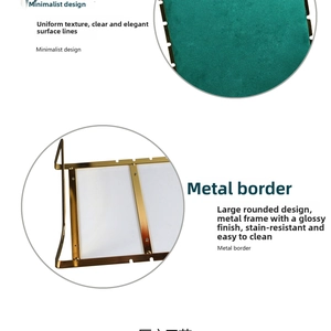 Detailed view of the gold metal frame and green velvet surface on this jewelry display