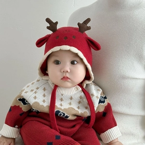 Cute red Christmas baby knit hat with elk antlers and ear flaps for winter warmth