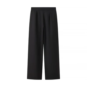 Detail of elegant black wide-leg trousers with smooth texture and minimalist design