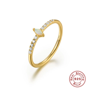 Macro shot of marquise opal gold ring in S925 silver with side zircon stones