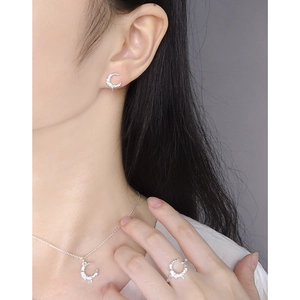 Elegant silver moon-shaped jewelry set with zircon moon earrings and necklace on model