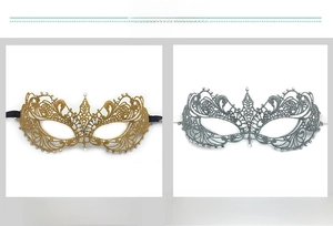 Detailed view of silver and gold lace masquerade masks with inlaid white rhinestones