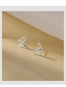Detailed shot of S999 silver butterfly earrings with colorful inlaid gemstones