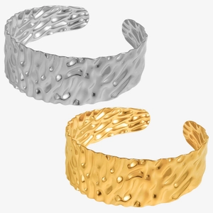 Modern wide hammered cuff bracelets in 18k gold and silver finishes with wavy texture