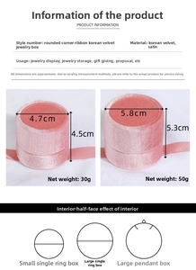 Nahaufnahme kleiner und großer runder Samt-Schmuckschatullen mit Satinband-Details