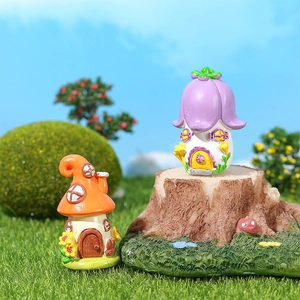 Miniature fairy garden resin houses with purple flower and orange mushroom roofs