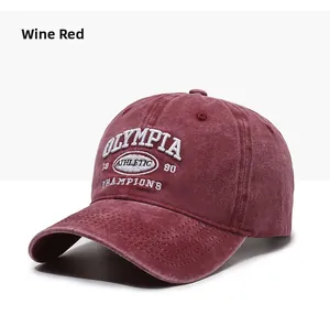 Close-up of Burgundy washed cotton baseball cap featuring vintage white embroidery details