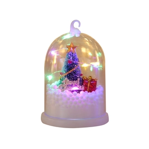 Christmas LED light ornament with green tree, red gift boxes, and artificial snow