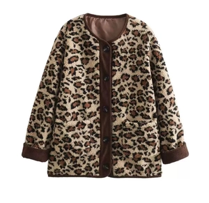 Detail of leopard print fleece jacket with brown corduroy trim and button closure