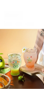 Close-up of heat-resistant glass cups with Chill lettering and a checkerboard base