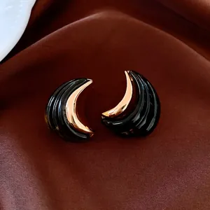 Luxury 18K gold-plated crescent earrings with textured black resin in vintage style