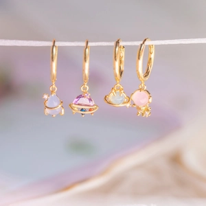 Space-themed 18K gold plated hoop earrings with colorful zircon astronaut and planet charms