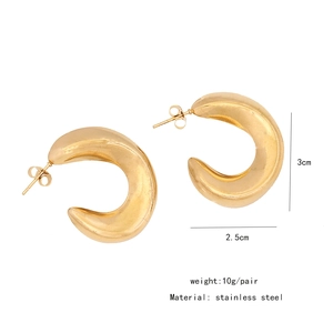 Detail of gold geometric C-shape stainless steel earrings with dimension markings