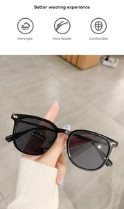 Detail of lightweight black square frame sunglasses with flexible temples and nose pads