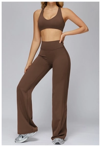 Detail of high-waist flared yoga pants and racerback sports bra in dark coffee brown