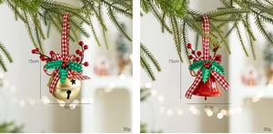 Detailed view of Christmas bell ornaments with red gingham bows and festive berry accents