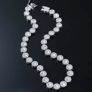 Men's hip hop silver iced out chain with round halo diamonds on black reflective background