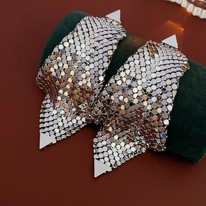 Detailed macro shot showing the silver metal mesh texture and craftsmanship of the earrings