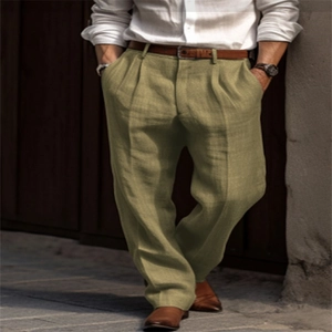 Detail of olive linen trousers showing relaxed straight fit and breathable fabric texture