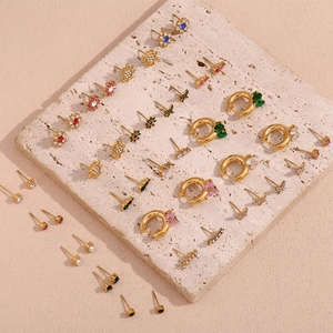 Detailed flat lay of 18K gold-plated floral earrings with colorful zircon inlays on stone