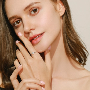 Elegant model wearing a classic 925 sterling silver ring with sparkling diamond inlay